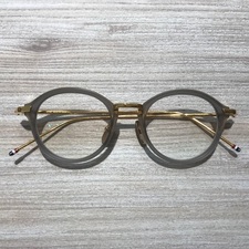 トムブラウン(THOM BROWNE)の通常使用感のあるグレイゴールドの度入り眼鏡を買取致しました。新宿三丁目です。状態は通常使用感のあるお品物です。