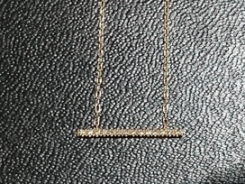 ヒロタカの0103001410 0.07ct K10YG ショートバーネックレスの買取実績です。