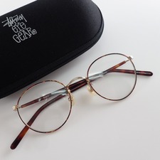 ステューシーのStussy Eyegear BENNY ラウンドタイプリム メタルフレーム 眼鏡/サングラスを買取させていただきました。宅配買取センター状態は若干の使用感がある中古品です。